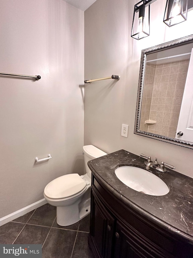 bathroom featuring vanity, toilet, and tile patterned floors