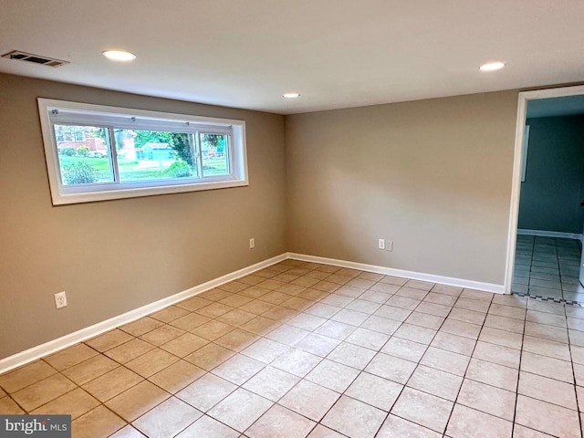 empty room with light tile patterned floors