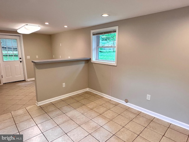 spare room with light tile patterned floors