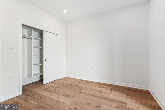 unfurnished bedroom featuring hardwood / wood-style floors