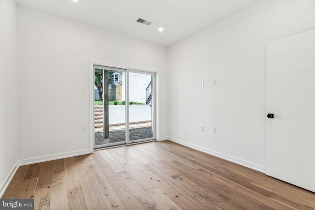 unfurnished room featuring light hardwood / wood-style flooring