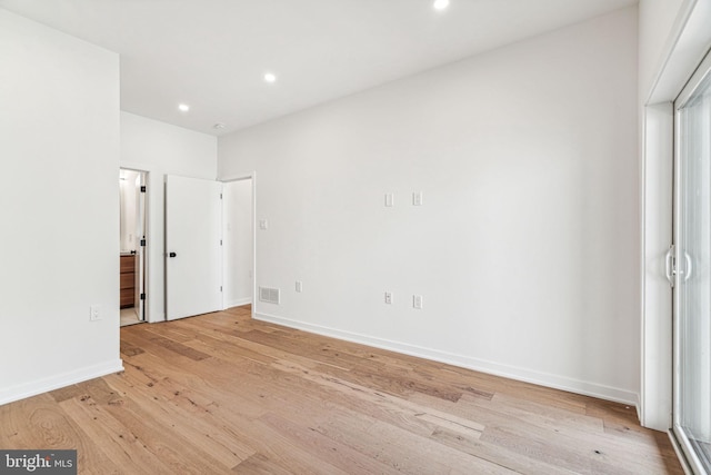 unfurnished bedroom featuring light wood-type flooring