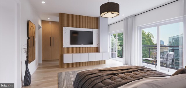 bedroom featuring access to outside and light hardwood / wood-style flooring