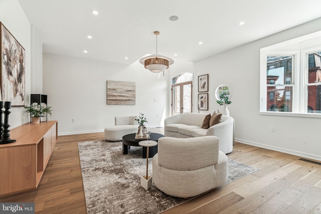 living room with light hardwood / wood-style flooring