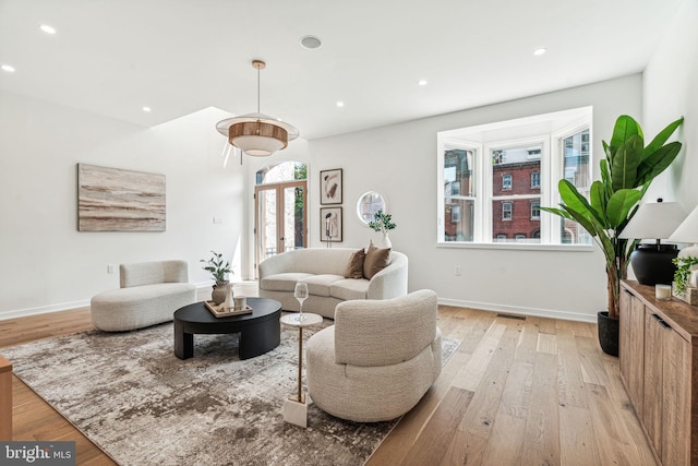 living room with light hardwood / wood-style floors