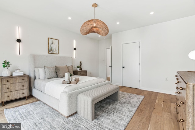 bedroom with hardwood / wood-style flooring