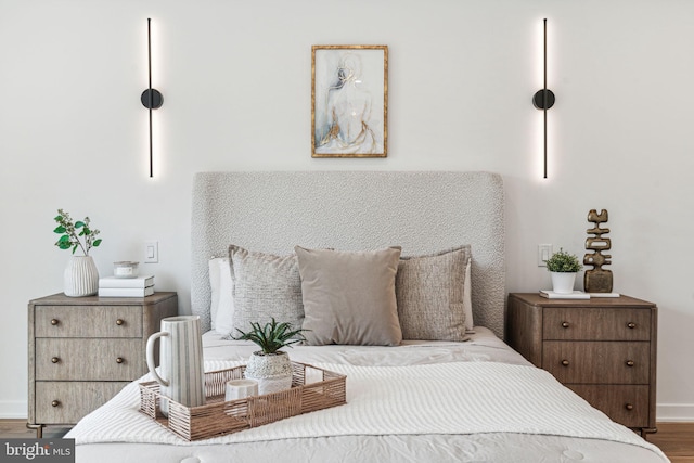 bedroom with wood-type flooring