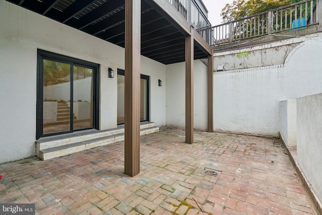 view of patio featuring a balcony