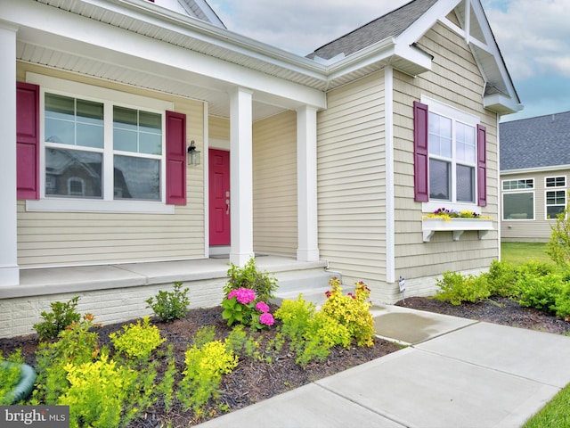 doorway to property featuring covered porch