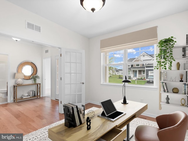 office space with light hardwood / wood-style flooring