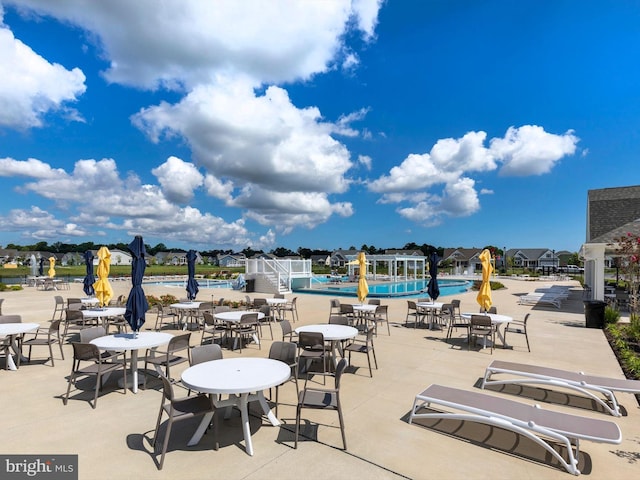 view of terrace featuring a community pool