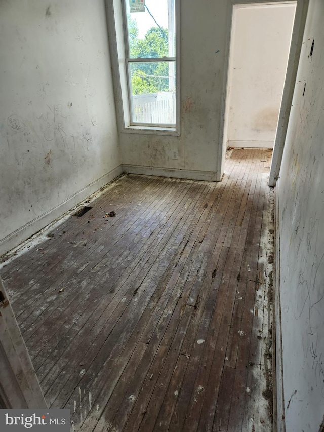 unfurnished room featuring wood-type flooring