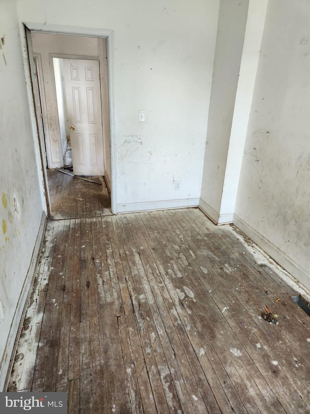 empty room with wood-type flooring