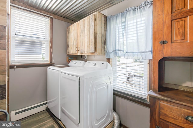 laundry room featuring separate washer and dryer, hardwood / wood-style flooring, a baseboard heating unit, and cabinets