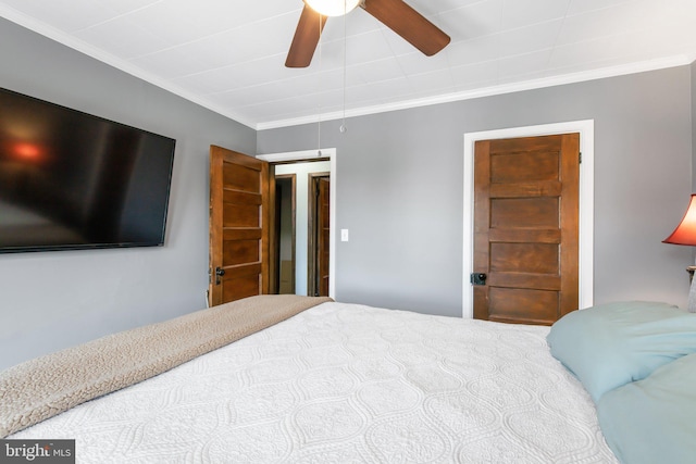 bedroom with ceiling fan and crown molding