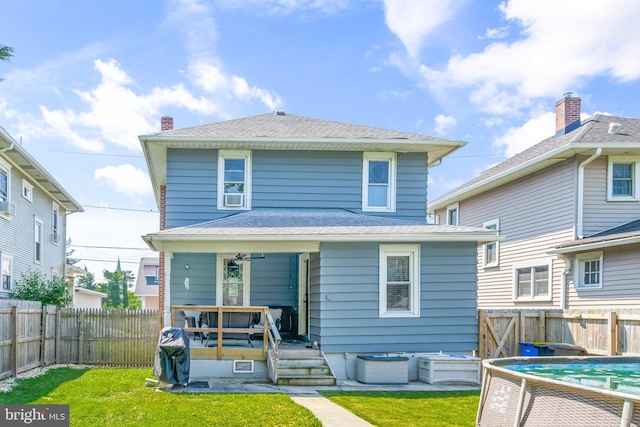 back of house with a yard