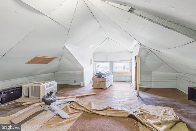 bonus room with lofted ceiling and hardwood / wood-style floors