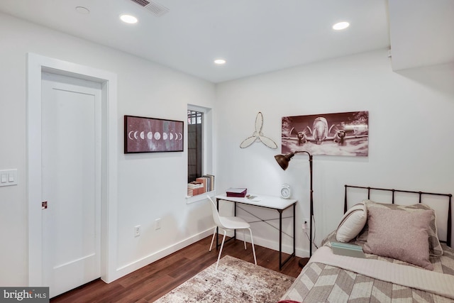 bedroom featuring dark wood-type flooring