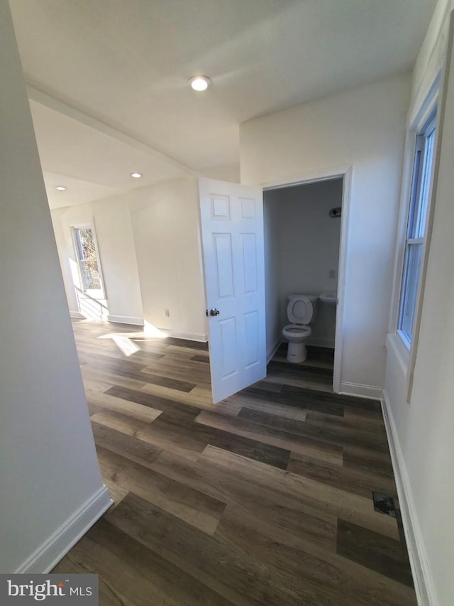 hallway featuring dark wood-type flooring