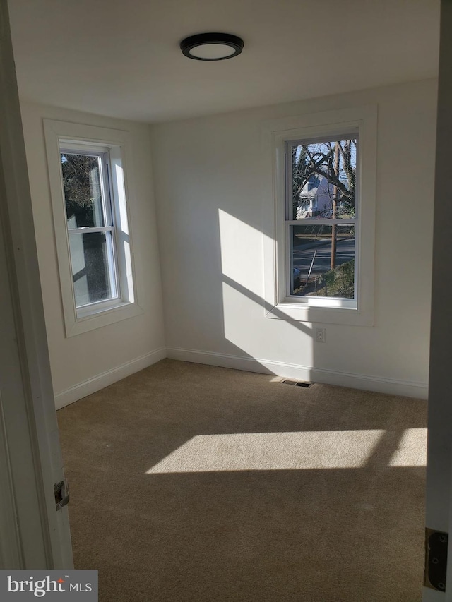 unfurnished room featuring carpet floors