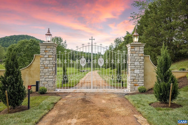 view of gate at dusk