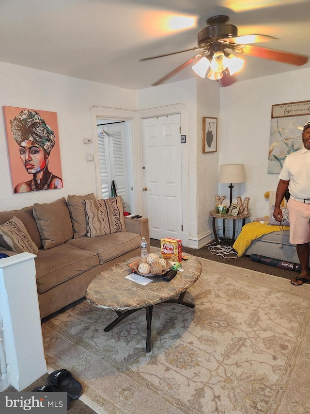 living room with ceiling fan