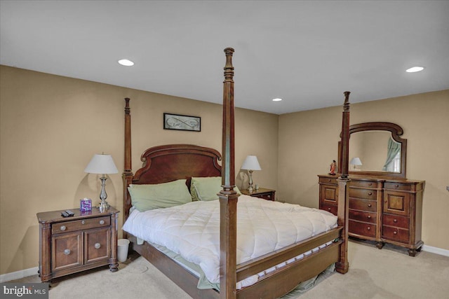 bedroom featuring light carpet