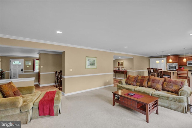 living room featuring carpet and crown molding