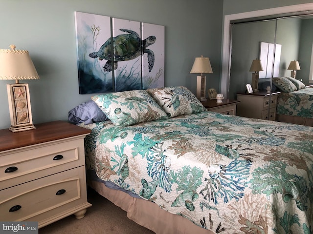 carpeted bedroom with a closet