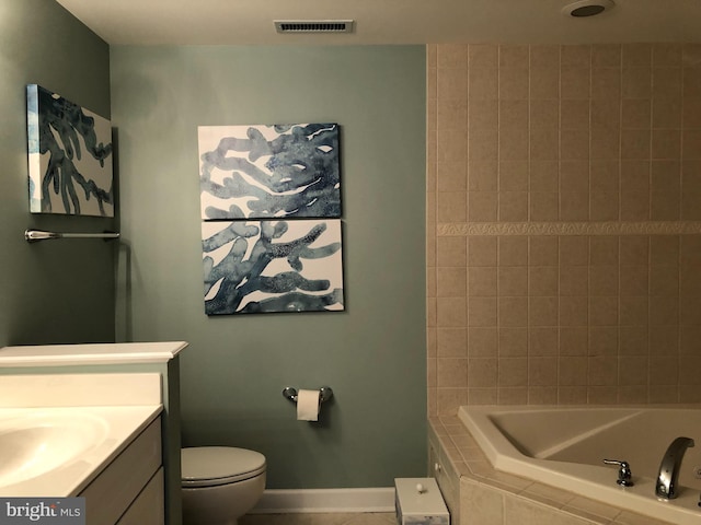 bathroom featuring tile floors, toilet, and vanity