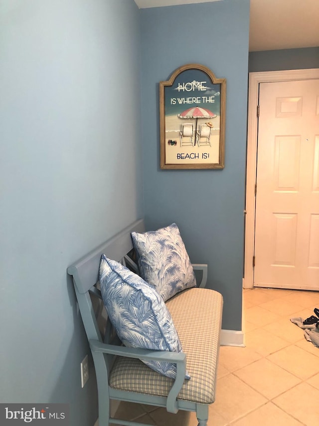 sitting room featuring tile floors