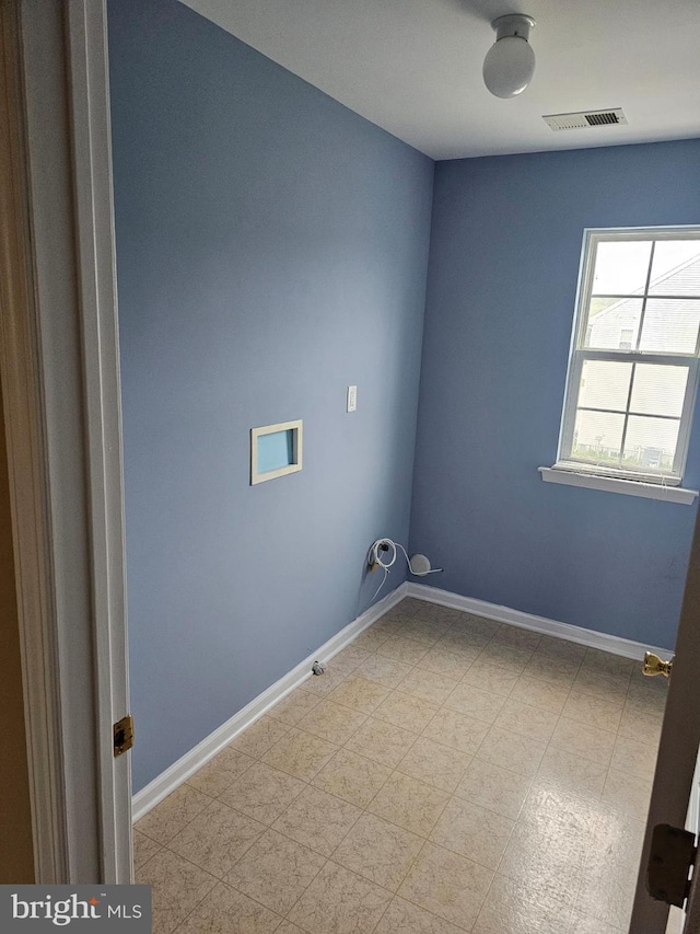 empty room with tile flooring