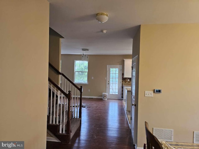 foyer with dark hardwood / wood-style flooring