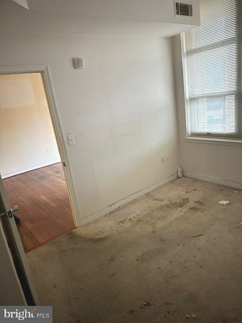 unfurnished room featuring hardwood / wood-style floors