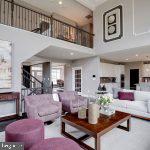 living room featuring a high ceiling