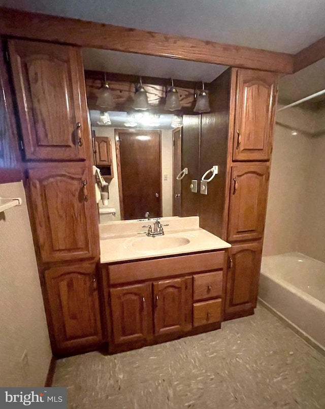 bathroom featuring vanity and tub / shower combination