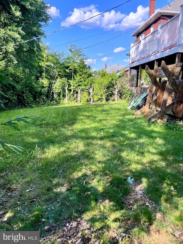 view of yard with a deck