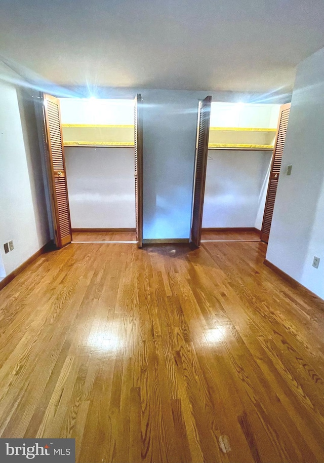 spare room with hardwood / wood-style flooring