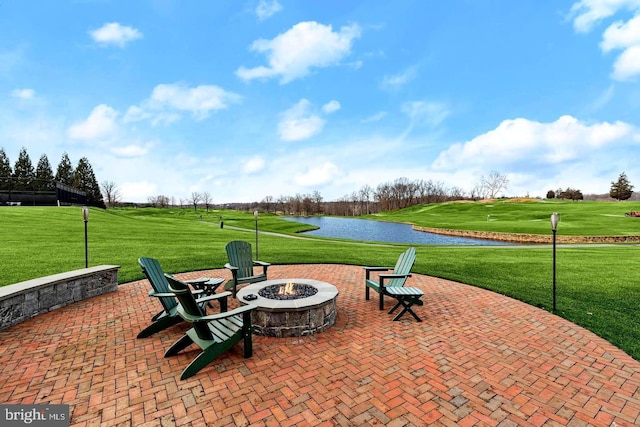 view of patio / terrace with a water view and an outdoor fire pit