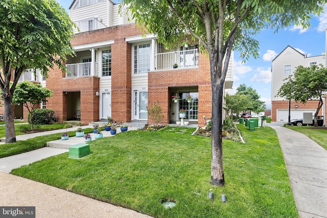 view of property featuring a front lawn