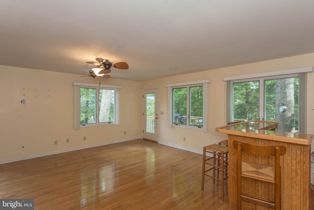 dining space featuring hardwood / wood-style floors and ceiling fan