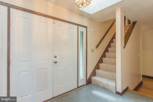 foyer entrance featuring tile flooring