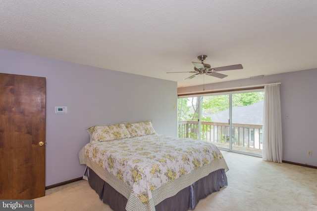 carpeted bedroom featuring a textured ceiling, ceiling fan, and access to exterior