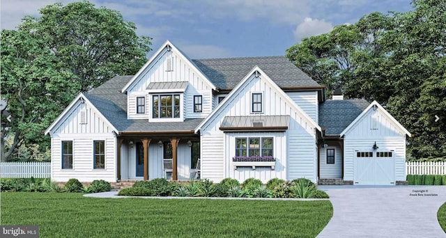 modern farmhouse with a front yard and a garage