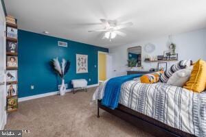 carpeted bedroom with ceiling fan