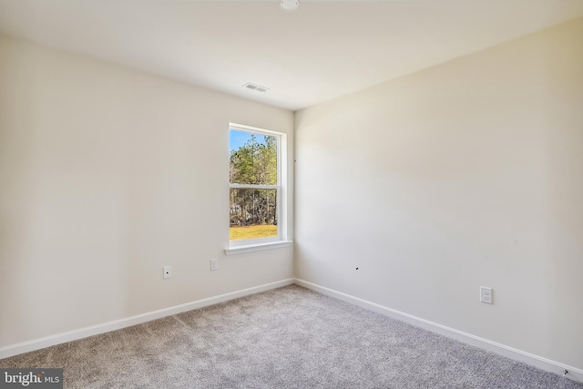 empty room featuring carpet flooring