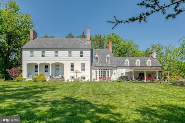 exterior space with a front lawn and covered porch