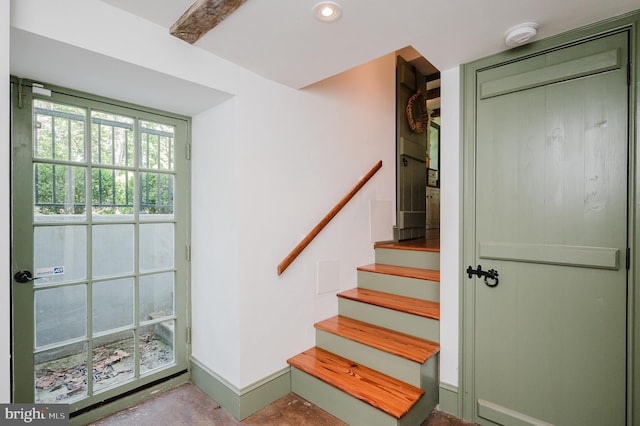 stairs with concrete floors