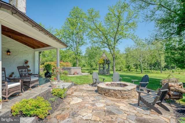 view of patio with an outdoor fire pit