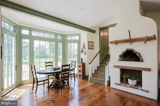 dining space featuring french doors and wood-type flooring